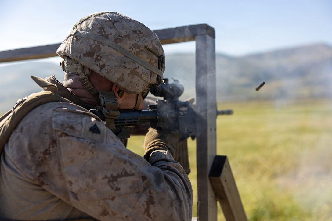 U.S. Marine Corps Cpl. Nicholas Bodily, a light armored vehicle driver with 4th Light Armored Reconnaissance, 4th Marine Division, shoots down range during the rifle skill range portion event during the 2026 Bushmaster Competition, Camp Pendleton, California, March 25, 2026. This year, hosted by 4th Light Armored Reconnaissance, 4th Marine Division, the friendly competition gathers Light Armored Vehicle crews from across the U.S. Marine Corps, Australia and New Zealand to test their tactical and technical skills. (U.S. Marine Corps photo by Sgt. Aaron TorresLemus)