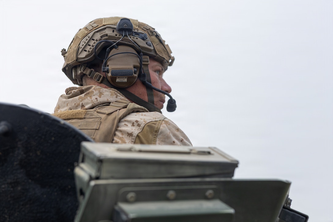 U.S. Marine Corps Sgt. Nathaniel Schneiders, light armor reconnaissance Marine with 3d Light Armored Reconnaissance, 1st Marine Division, locates first point for the mounted land navigation event during the 2026 Bushmaster Competition, Camp Pendleton, California, March 26, 2026. This year, hosted by 4th Light Armored Reconnaissance, 4th Marine Division, the friendly competition gathers Light Armored Vehicle crews from across the U.S. Marine Corps, Australia and New Zealand to test their tactical and technical skills. (U.S. Marine Corps photo by Sgt. Aaron TorresLemus)