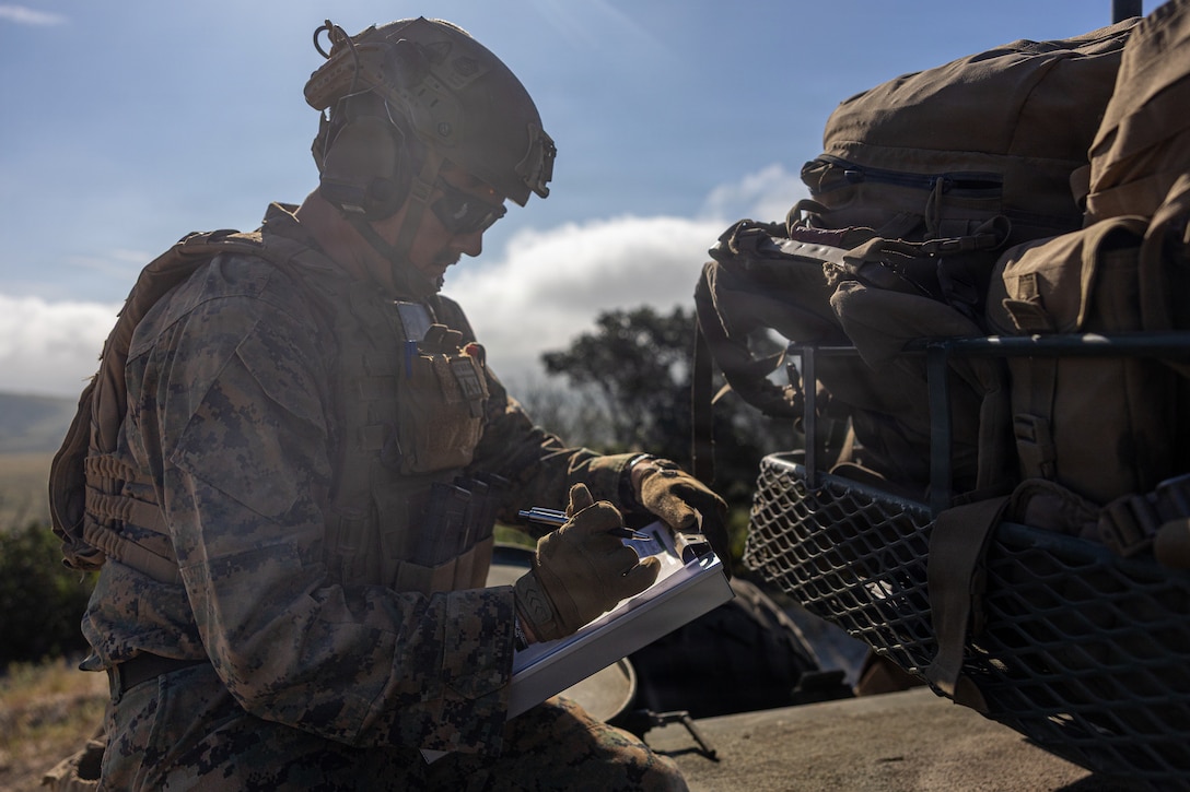 U.S. Marine Corps Gunnery Sgt. Cole Reeb, combat instructor with Alpha Company, School of Infantry-West, Training Command, evaluates a squad of competitors for the mounted land navigation event during the 2026 Bushmaster Competition, Camp Pendleton, California, March 26, 2026. This year, hosted by 4th Light Armored Reconnaissance, 4th Marine Division, the friendly competition gathers Light Armored Vehicle crews from across the U.S. Marine Corps, Australia and New Zealand to test their tactical and technical skills. (U.S. Marine Corps photo by Sgt. Aaron TorresLemus)