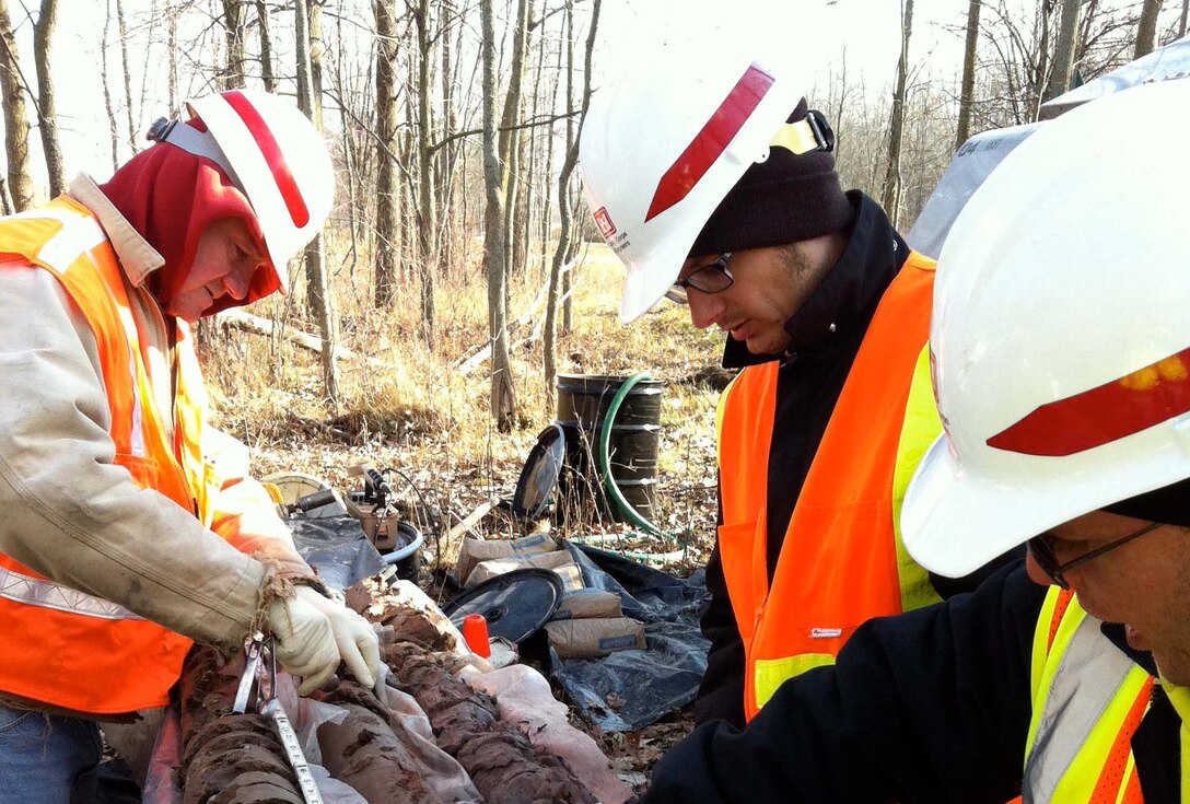 Health physicists conduct soil sampling at a FUSRAP site. (Courtesy Photo)