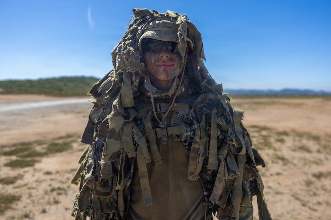 Australian Army Trooper Rieley Ward, a combat reconnaissance vehicle gunner with the Australian Army’s School of Armor, poses for a photo prior to the cover and concealment event during the 2026 Bushmaster Competition, Camp Pendleton, California, March 26, 2026. This year, hosted by 4th Light Armored Reconnaissance, 4th Marine Division, the friendly competition gathers Light Armored Vehicle crews from across the U.S. Marine Corps, Australia and New Zealand to test their tactical and technical skills. (U.S. Marine Corps photo by Sgt. Aaron TorresLemus)