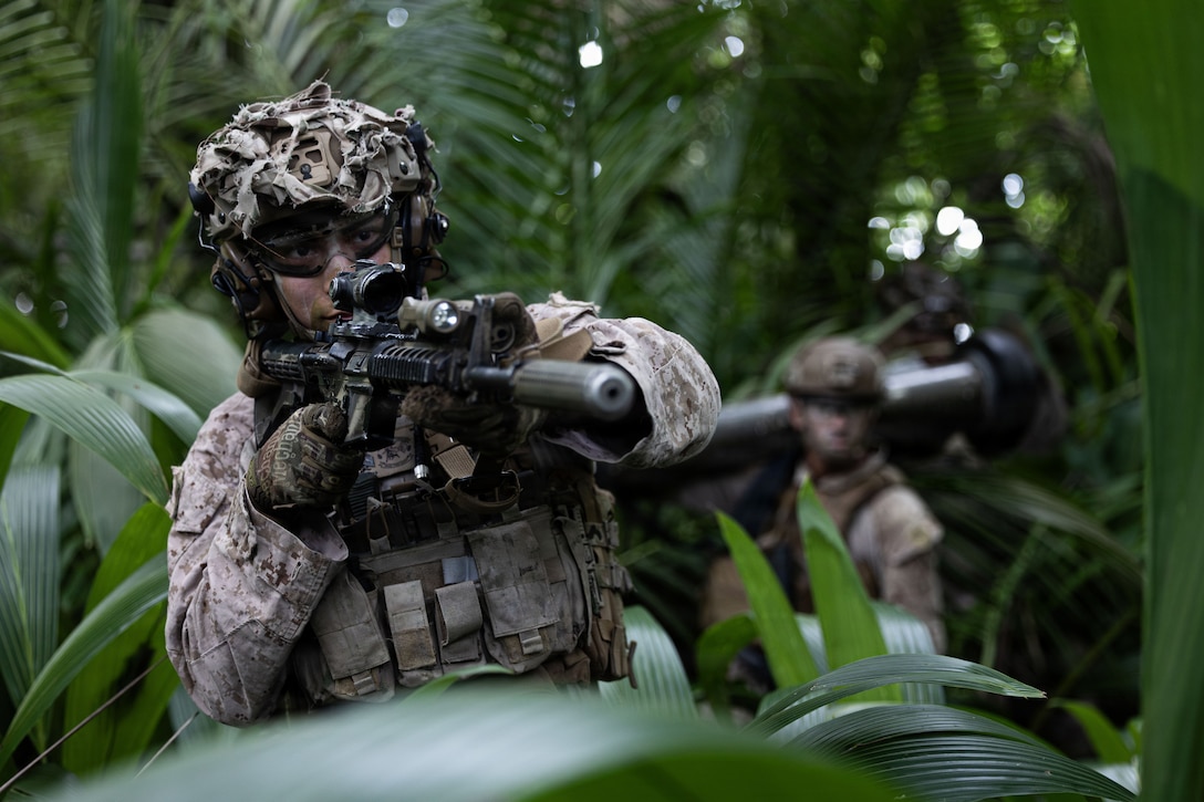 U.S. Marines with Lima Company, Battalion Landing Team 3rd Battalion, 1st Marine Regiment, 31st Marine Expeditionary Unit, conduct a patrol during a simulated amphibious assault in the U.S. 7th Fleet area of operations, March 24, 2026. The 31st MEU is a persistent, combat credible force operating aboard the ships of the Tripoli Amphibious Ready Group in the U.S. 7th Fleet area of operations, routinely interacting and operating with our allies and partners to contribute to deterrence, security, crisis response, and combat operations in the Indo-Pacific region. (U.S. Marine Corps photo by Cpl. Maksim Masloboev)