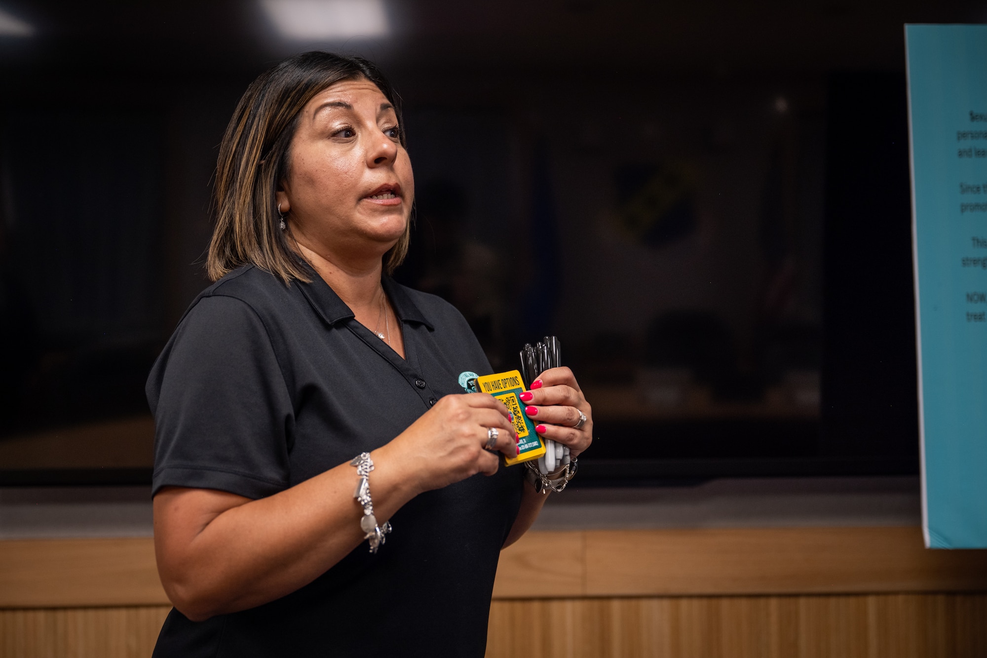 Marisa Hensley, Dyess Air Force Base Sexual Assault Response Coordinator, speaks about sexual assault awareness and available resources during a Sexual Assault Awareness Month proclamation signing at Dyess AFB, Texas, April 1, 2026. The SARC serves as the primary contact for integrating, coordinating and providing care for survivors of sexual assault. (U.S. Air Force photo by Airman 1st Class Adrien Tran)