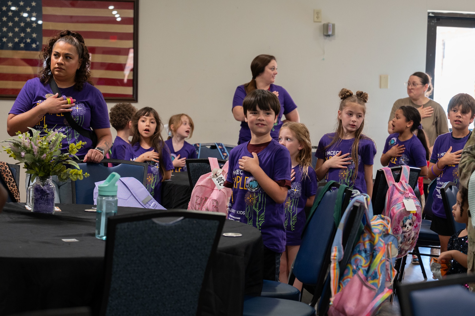 Children recite the Pledge of Allegiance during the 2026 Month of the Military Child proclamation ceremony at Dyess Air Force Base, Texas, April 2, 2026. There are more than 1.6 million military children who face many challenges and unique experiences as a result of their parents' service. (U.S. Air Force photo by Senior Airman Alondra Cristobal Hernandez)