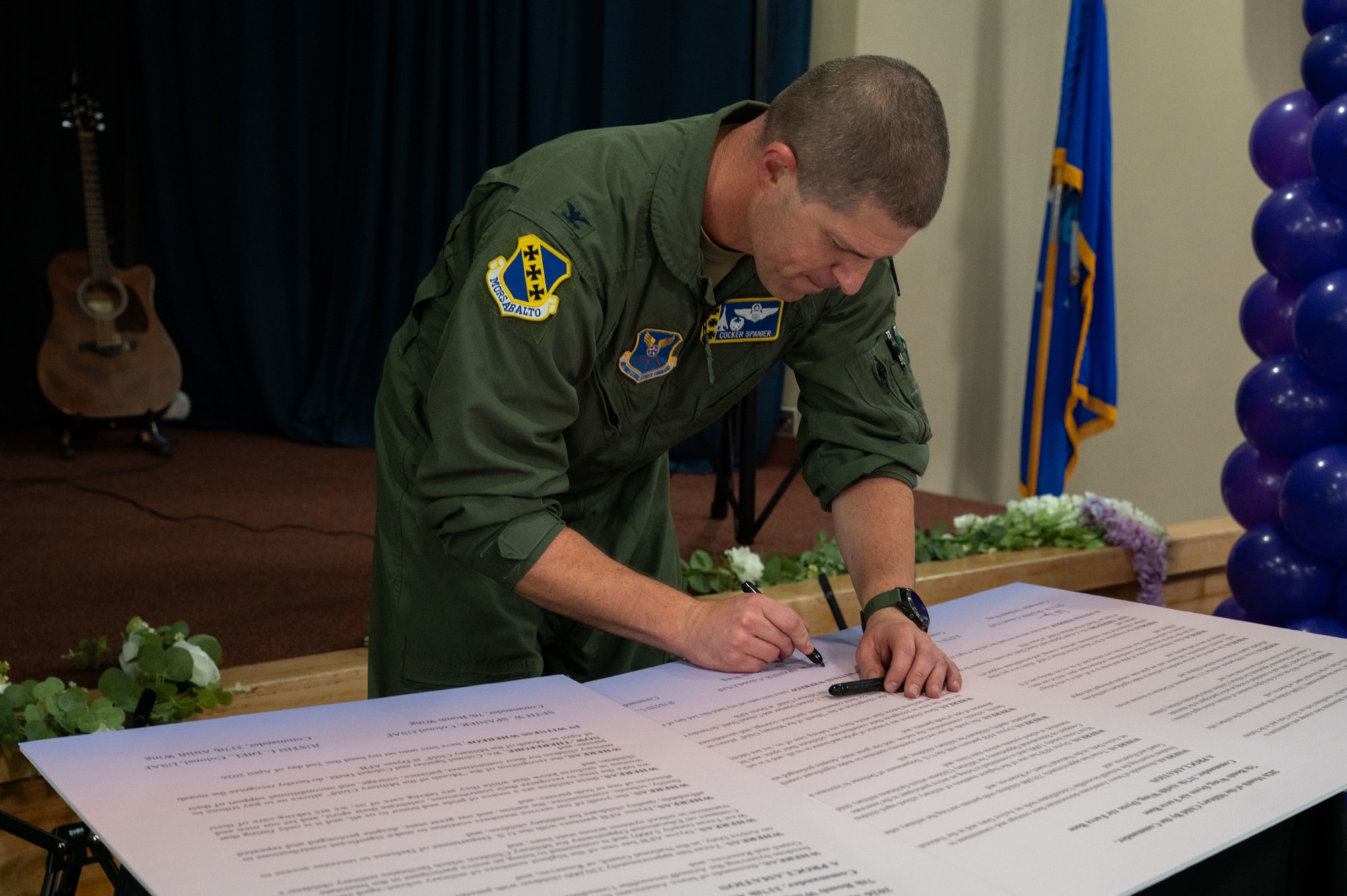 U.S. Air Force Col. Seth Spanier, 7th Bomb Wing and installation commander, signs the 2026 Month of the Military Child proclamation at Dyess Air Force Base, Texas, April 2, 2026.  Each year, the Department of War joins national, state, and local government, schools, military service organizations, companies, and private citizens in celebrating military children and the sacrifices they make. (U.S. Air Force photo by Senior Airman Alondra Cristobal Hernandez)