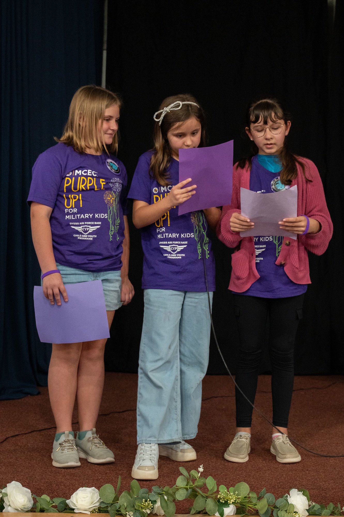 Children recite the poem “I Serve Too” during the 2026 Month of the Military Child proclamation ceremony at Dyess Air Force Base, Texas, April 2, 2026. The poem highlights how military children support their families and adapt to unique challenges such as deployments, frequent moves and new environments. (U.S. Air Force photo by Senior Airman Alondra Cristobal Hernandez)