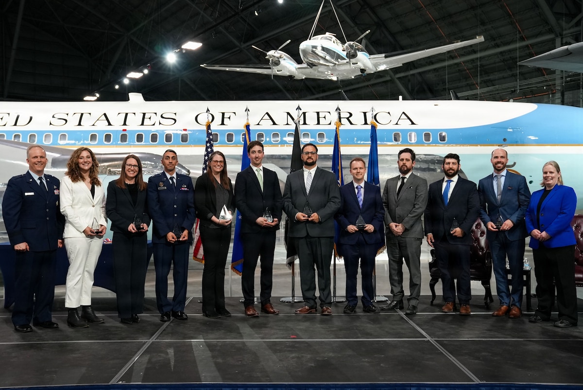 All 10 AFRL Early Career Award winners standing with AFRL Commander Brig. Gen. Jason Bartolomei and AFRL Chief Technology Officer Dr. Kath-Anne Soderberg.