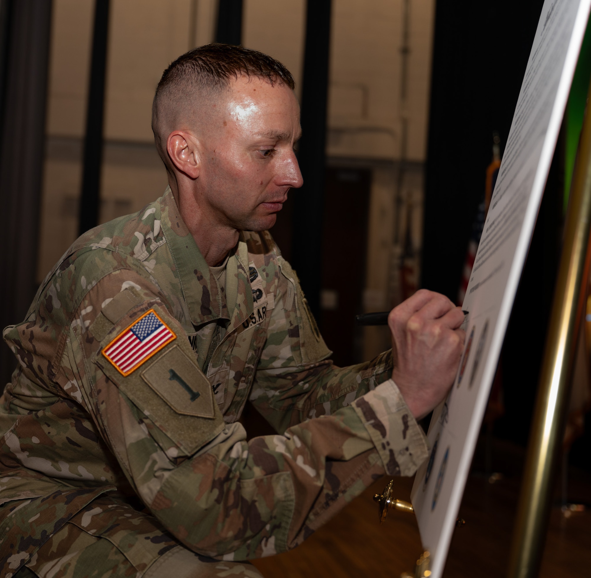 U.S. Army Col. Bryan Dunker, Joint Base McGuire-Dix-Lakehurst deputy commander and U.S. Army Support Activity Fort Dix commander, signs the Month of the Military Child Proclamation at JB MDL, N.J., April 1, 2026. Each year the Department of War partners with national, state and local governments, schools, military organizations, private companies and citizens to celebrate military children and the unique challenges they may face. (U.S. Air Force photo by Airman 1st Class Haeleigh Bayle)