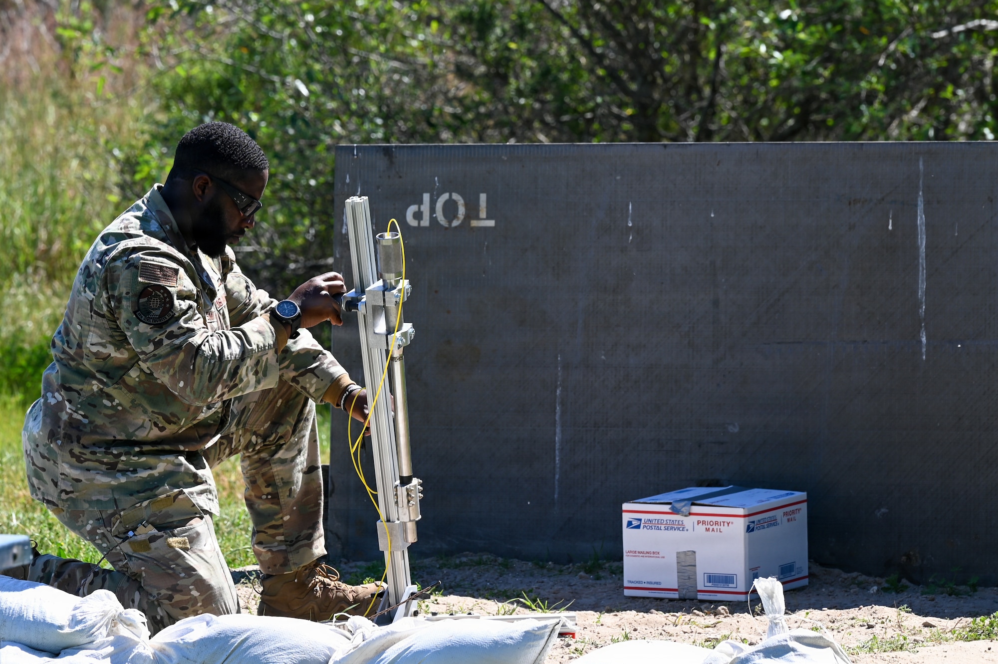 U.S. Air Force Senior Airman Duane Smith, 30th Civil Engineer Squadron Explosive Ordnance Disposal technician, prepares a defusal device at an EOD facility.