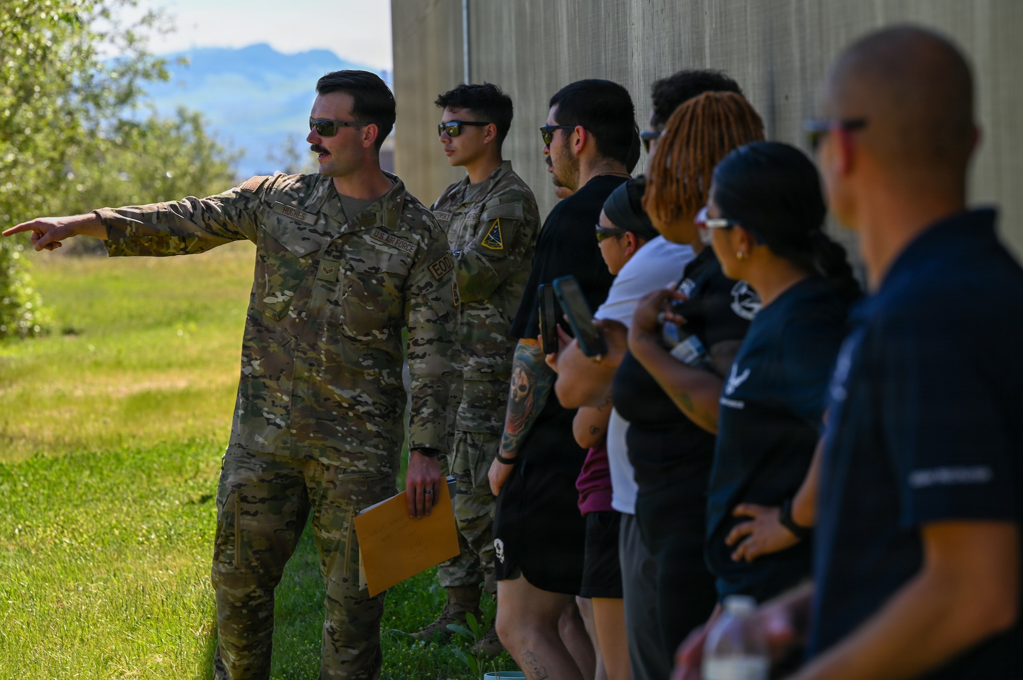 U.S. Air Force Senior Airman Dylan Hughes, 30th Civil Engineer Squadron Explosive Ordnance Disposal technician, speaks before an improvised explosive device demonstration at an EOD facility.