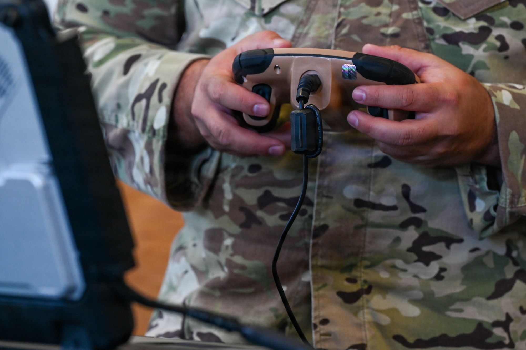 U.S. Air Force Tech. Sgt. Charles de Guia, 30th Civil Engineer Squadron Explosive Ordnance Disposal logistics noncommissioned officer in charge, utilizes a manned transportable robotic system at an EOD facility.