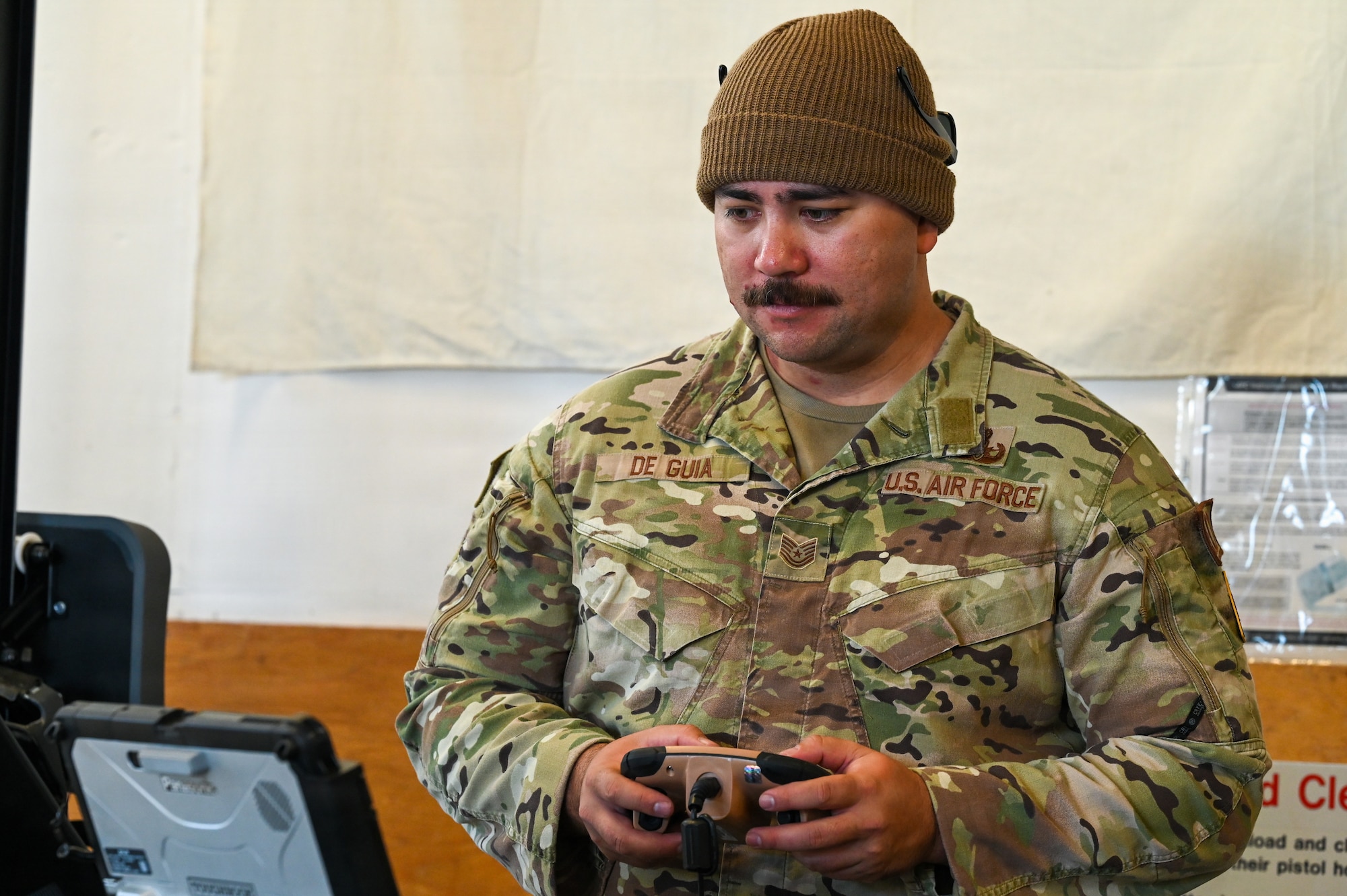 U.S. Air Force Tech. Sgt. Charles de Guia, 30th Civil Engineer Squadron Explosive Ordnance Disposal logistics noncommissioned officer in charge, utilizes a manned transportable robotic system at an EOD facility.