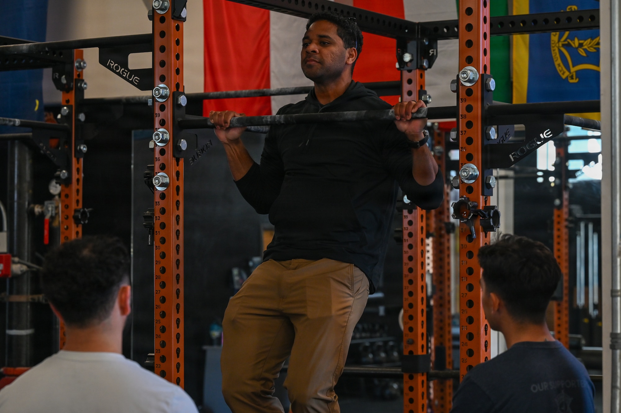 U.S. Air Force Tech. Sgt. Anthony Griffin, Air Force Special Warfare scout, demonstrates pull-up form at a gym.