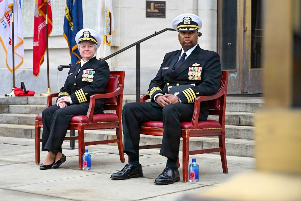 BETHESDA, Md. (Apr. 2, 2026) Capt. Darla Dietrich, commanding officer, Navy Medicine Readiness and Training Command (NMRTC) Bethesda and Capt. Robert Jones Jr., command chaplain, NMRTC Bethesda, listen to Capt. Jeffrey Klinger, outgoing commanding officer, NMRTC Bethesda, during a combined change of command and retirement ceremony, at Walter Reed National Military Medical Center, Apr. 2, 2026. NMRTC Bethesda’s mission is to maximize warfighter performance through optimized medical readiness tailored to operational requirements; enhance the readiness of the medical force to sustain expeditionary medical capability; and train and develop the Navy Medicine Force. (U.S. Navy photo Mass Communication Specialist Second Class Alec Kramer)