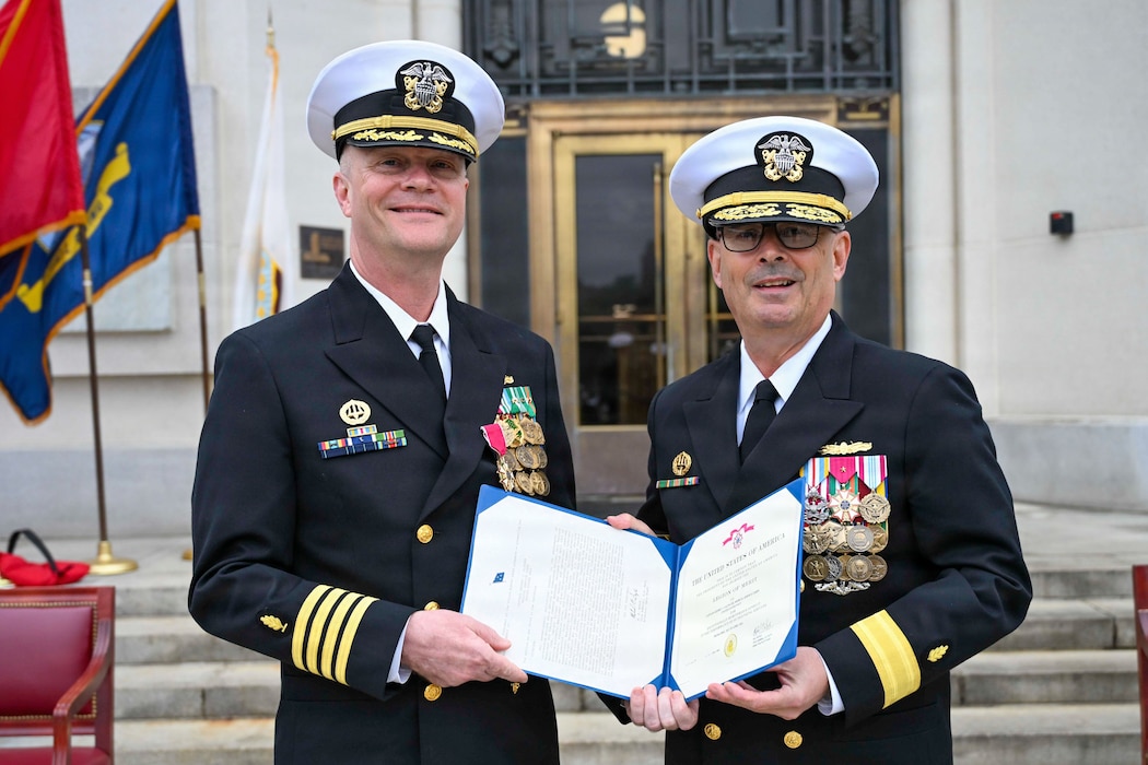 BETHESDA, Md. (Apr. 2, 2026) Capt. Jeffrey J. Klinger, outgoing commanding officer, Navy Medicine Readiness and Training Command (NMRTC) Bethesda, is awarded the Legion of Merit by Rear Adm. Robert J. Hawkins, commander, Naval Medical Forces Atlantic and director, Defense Health Network Atlantic during a combined change of command and retirement ceremony, at Walter Reed National Military Medical Center, Apr. 2, 2026. NMRTC Bethesda’s mission is to maximize warfighter performance through optimized medical readiness tailored to operational requirements; enhance the readiness of the medical force to sustain expeditionary medical capability; and train and develop the Navy Medicine Force. (U.S. Navy photo Mass Communication Specialist Second Class Alec Kramer)