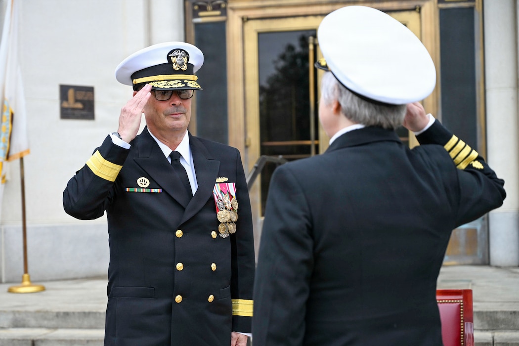 BETHESDA, Md. (Apr. 2, 2026) Capt. Darla Dietrich, commanding officer, Navy Medicine Readiness and Training Command (NMRTC) Bethesda, salutes Rear Adm. Robert J. Hawkins, commander, Naval Medical Forces Atlantic and director, Defense Health Network Atlantic during a combined change of command and retirement ceremony, at Walter Reed National Military Medical Center, Apr. 2, 2026. NMRTC Bethesda’s mission is to maximize warfighter performance through optimized medical readiness tailored to operational requirements; enhance the readiness of the medical force to sustain expeditionary medical capability; and train and develop the Navy Medicine Force. (U.S. Navy photo Mass Communication Specialist Second Class Alec Kramer)