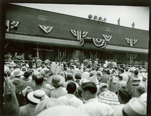 President Harry S. Truman inaugurates Arnold Air Force Base in 1951, speaking from the platform of its very first building. Seventy-five years later, this historic structure continues to serve as a crucial logistics hub for the vastly expanded base. (U.S. Air Force photo by Keith Thornburgh)