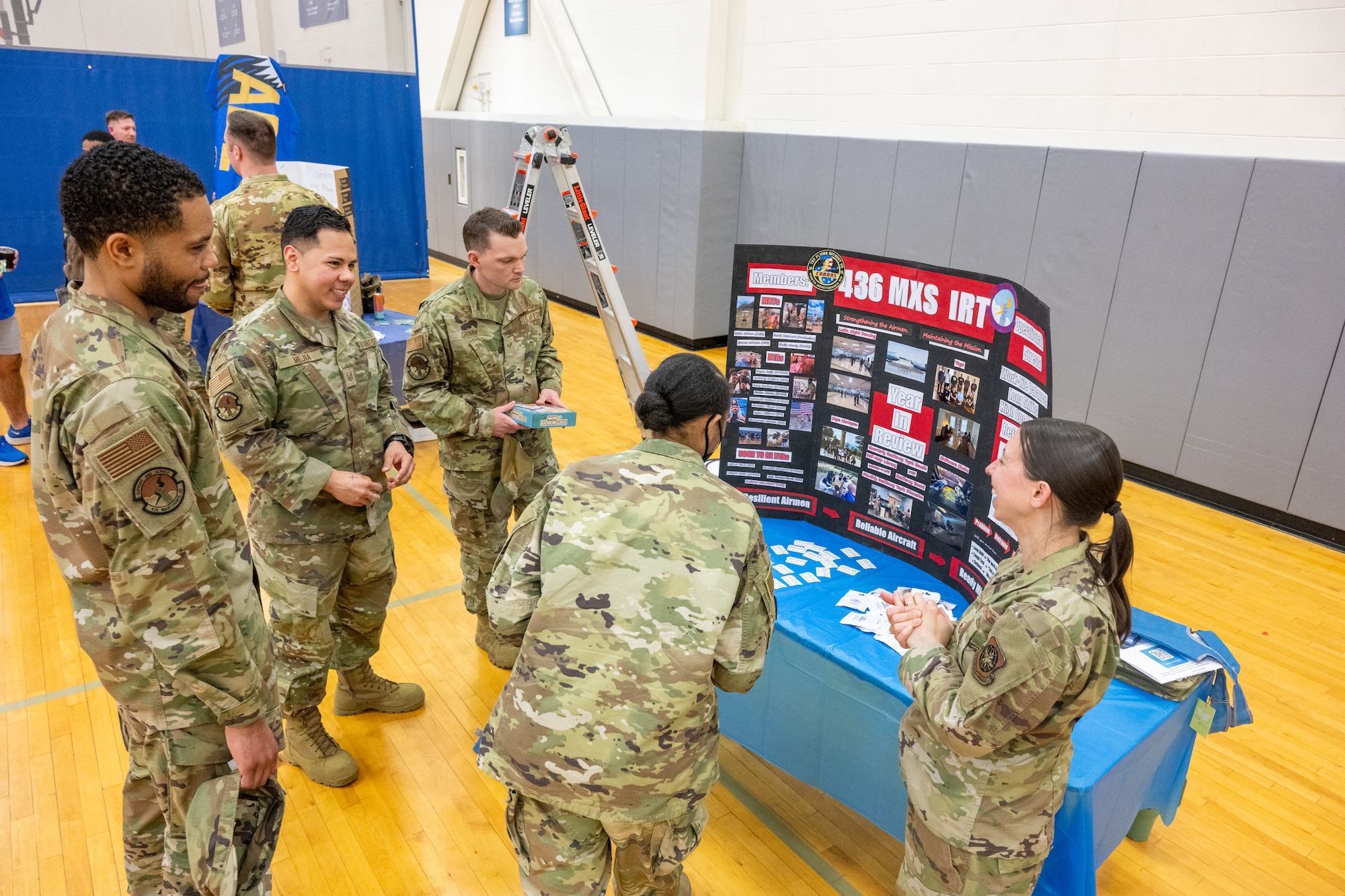 U.S. Air Force Airmen visit a booth set up by the 436th Maintenance Squadron master resiliency trainer during the 2026 Resilience Team Showcase at Dover Air Force Base, Delaware, March 26, 2026. The event had 98 Airmen, family members and civilian employees in attendance. (U.S. Air Force photo by Mauricio Campino)