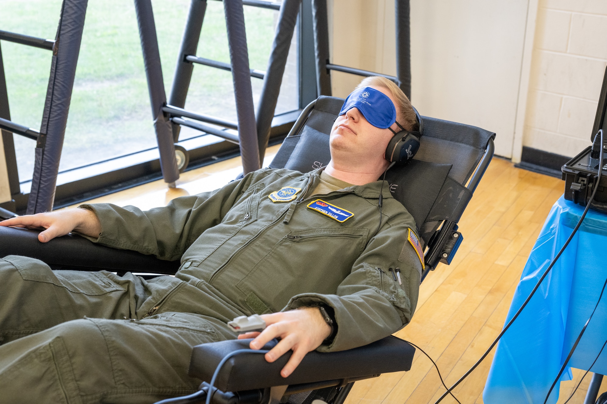 U.S. Air Force Capt. Stephen Dillon, 3rd Airlift Squadron C-17 Globemaster III pilot, uses a Shift Wave chair during the 2026 Resilience Team Showcase at Dover Air Force Base, Delaware, March 26, 2026. The chair engages the nervous system during meditation to help build mental resilience. (U.S. Air Force photo by Mauricio Campino)