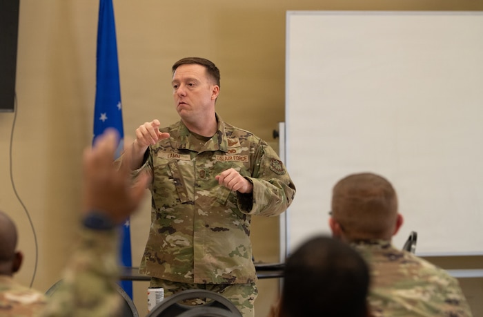 A chief master sergeant speaks to a crowd