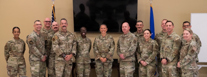 Military members pose for a photo