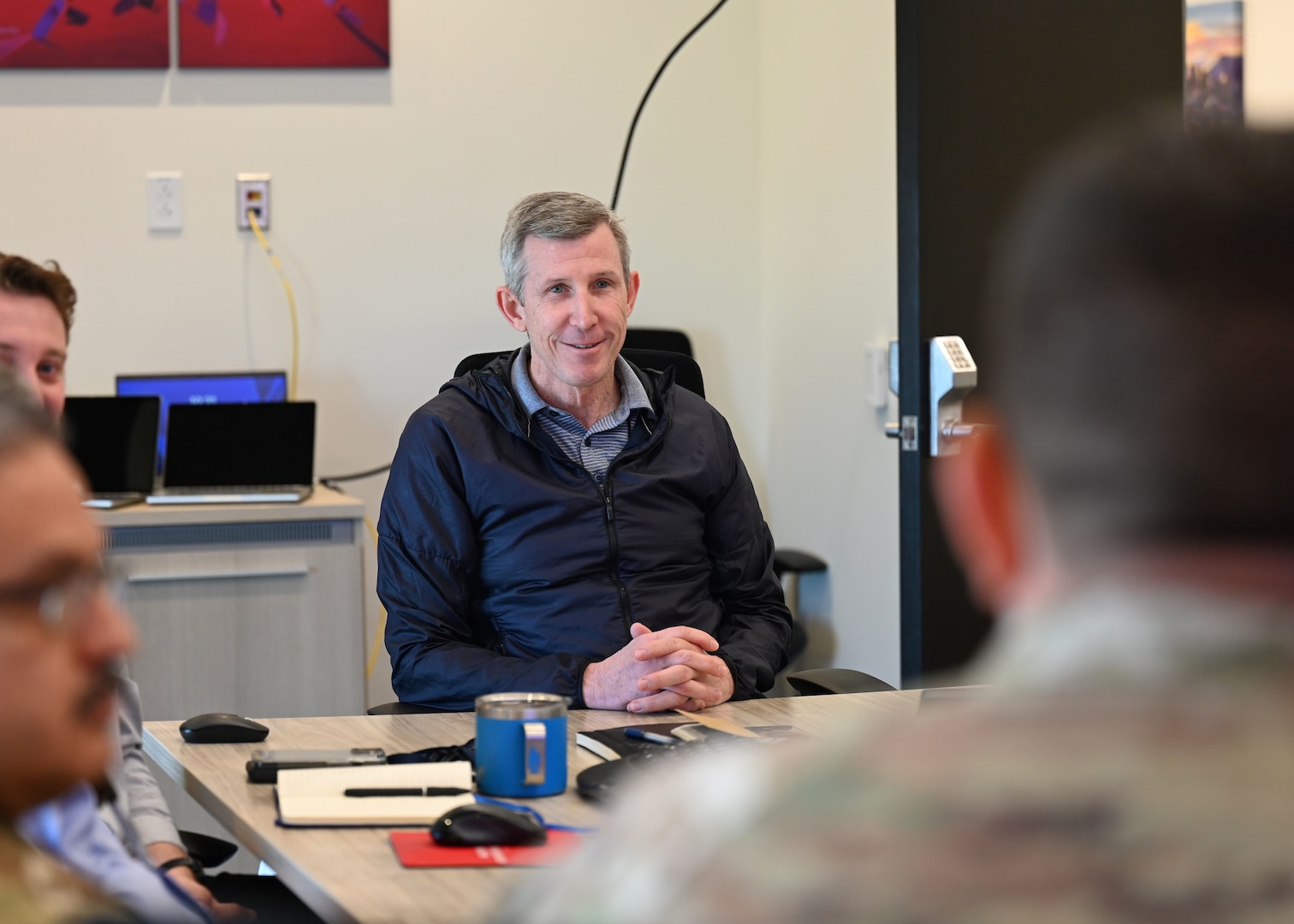 U.S. Air Force Maj. Gen. (ret) Joseph Kunkel, University of Arizona’s Kyl Institute for National Security executive vice president and chief operating officer, engages with members from U.S. Space Forces Southern, in Tucson, Arizona, April 2, 2026. SPACEFOR-SOUTH’s partnerships with academic institutions are fundamental for advancing space capabilities in the U.S. Southern Command area of responsibility. (U.S. Air Force photo by Staff Sgt. Abbey Rieves)