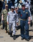 Cmdr. Adam Peeples, commanding officer of Whidbey Island-class dock landing ship USS Ashland (LSD 48) [right], speaks to Philippine Navy Rear Adm. Juario C. Marayag, Commander, Naval Sea Systems Command, during a visit to the ship as part of ship wartime repair and maintenance exercise (SWARMEX) in Cebu, Philippines, March 25, 2026.