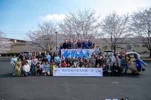 Event attendees pose for a group photo.