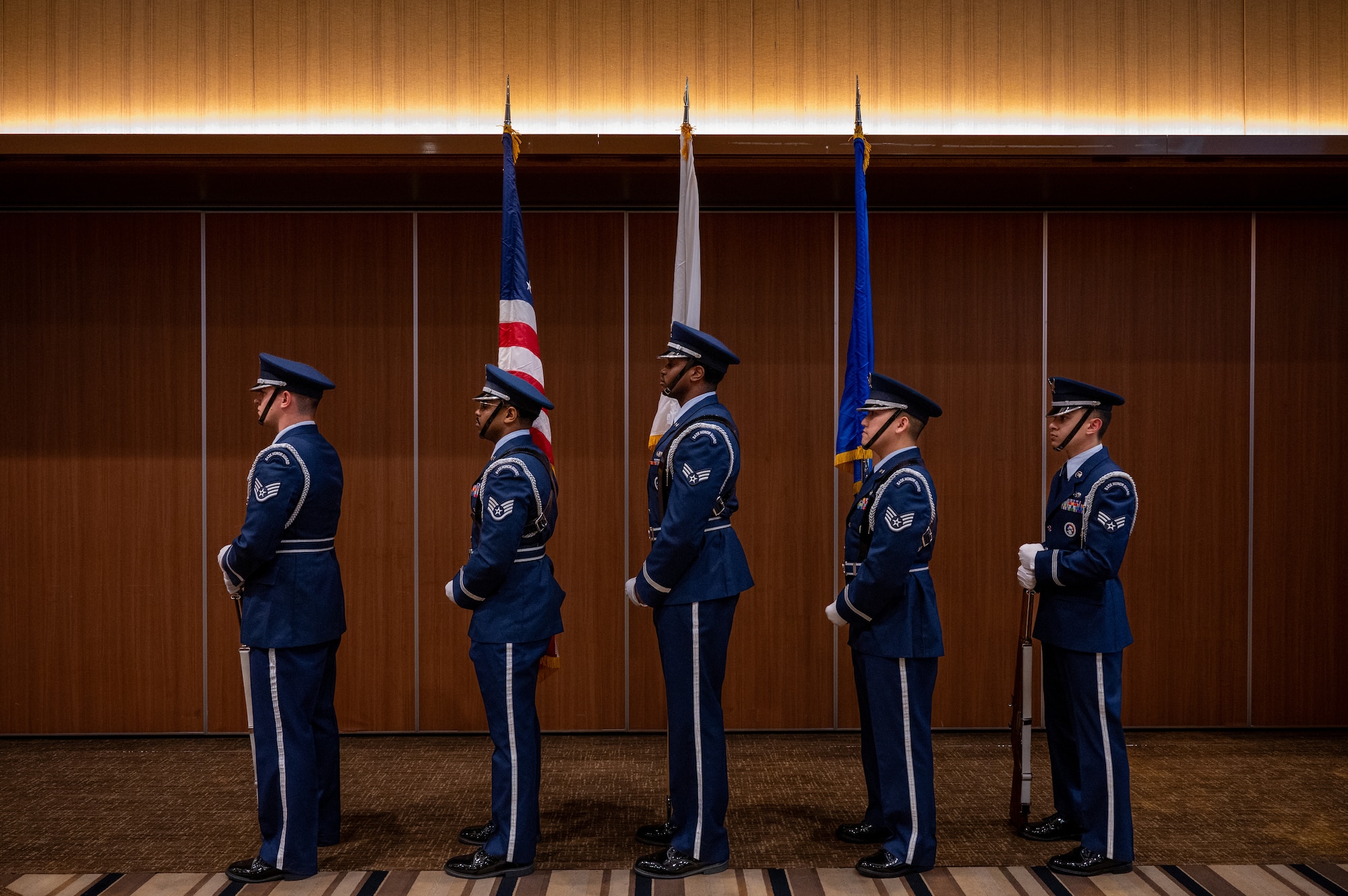 U.S. Air Force Kadena Honor Guard members prepare to present the colors during a chief induction ceremony at Kadena Air Base, Japan, March 28, 2026. The chief induction ceremony recognizes leadership responsibilities, commitment to mentorship and dedication to upholding the Air Force’s core values. (U.S. Air Force photo by Airman 1st Class Francisco Huerta)