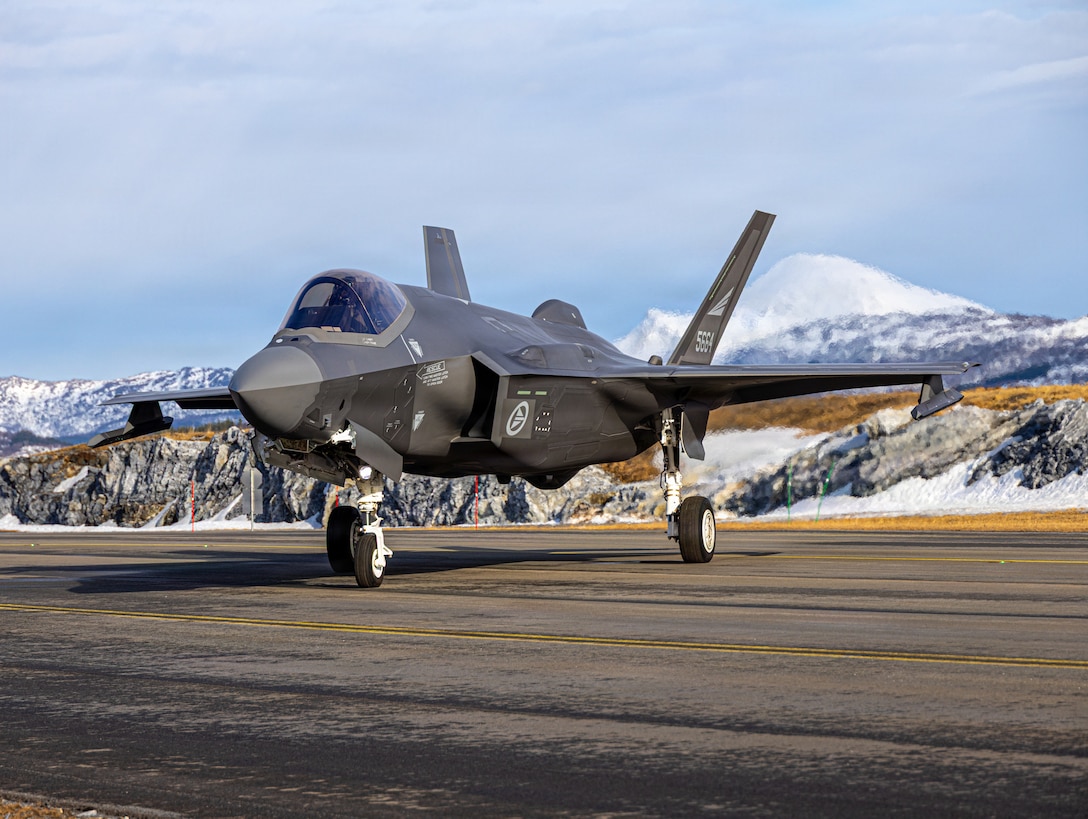 A Norwegian F-35A Lightning II with 132nd Air Wing, 332nd squadron, is staged during forward arming and refueling point operations during exercise Cold Response to increase allied interoperability. Marine Wing Support Squadron (MWSS) 273, Marine Air Control Group 28, 2nd Marine Aircraft Wing, established a forward arming and refueling point allows aviation assets to rapidly receive fuel and ordnance closer to the area of operations, which increases their operational tempo and lethality during exercise Cold Response 26. A key component of NATO's enhanced vigilance activity Arctic Sentry, exercise Cold Response 26 is a Norwegian-led winter military exercise designed to enhance collective defense capabilities and ensure U.S. readiness to rapidly deploy and seamlessly operate alongside NATO Allies in challenging arctic conditions. (U.S. Marine Corps photo by Lance Cpl. Donovan Pimentel)