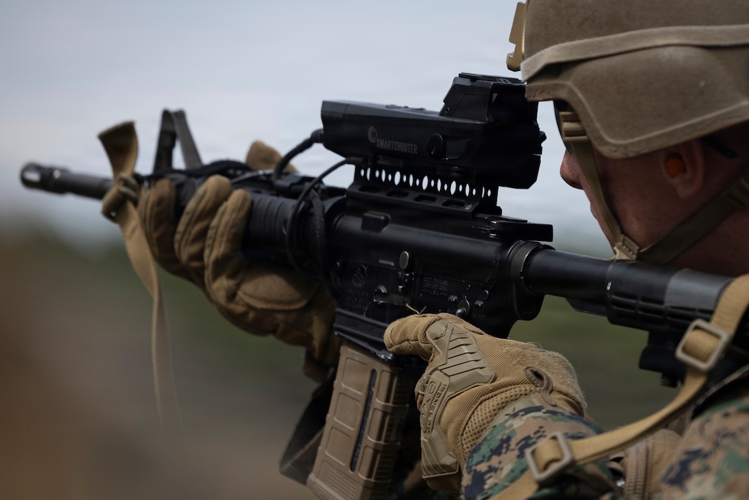 U.S. Marine Corps Lance Cpl. Riley Owen, from Tennessee, a low altitude air defense gunner with 2nd Low Altitude Air Defense Battalion, Marine Air Control Group 28, 2nd Marine Aircraft Wing, takes part in a SMASH 2000 L fire control system range at Marine Corps Base Lejeune, North Carolina, March 25, 2026. 2nd LAAD conducted a SMASH 2000 L that increased LAAD gunner proficiency while enhancing small arms accuracy with direct fire weapons. (U.S. Marine Corps photo by Lance Cpl. Perri Wood)