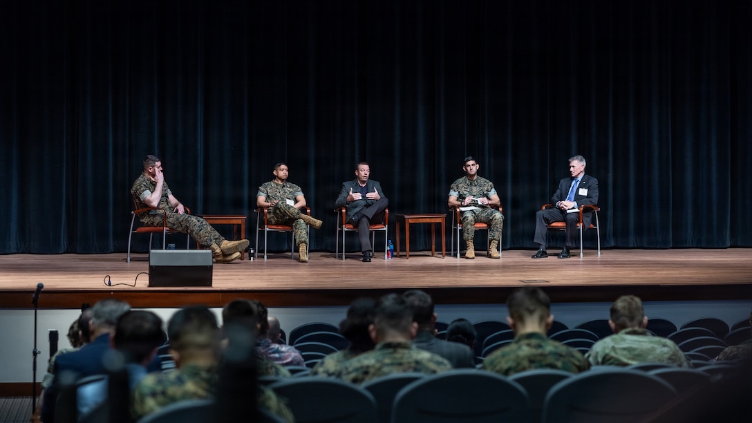 U.S. service members and civilians attend the Generative and Agentic AI Workshop at Warner Hall on MCB Quantico on March 12, 2026. The event aimed to identify high-impact AI uses, evaluate industry solutions, and establish a plan for integrating AI tools to enhance warfighter capabilities. (U.S. Marine Corps photo by Lance Cpl. Ethan Miller)