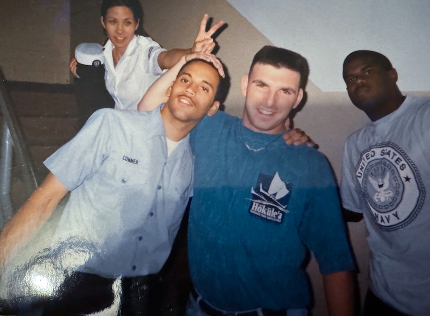 Seaman Robert ‘Brian’ Conner (far left front row) in a candid shot with classmates as another classmate photobombs Conner with ‘bunny ears’ taken during ET ‘A’ School in 1997.  (Courtesy photo provided by Capt. Conner / RELEASED)