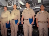 Lt.j.g. Robert ‘Brian’ Conner (second from the left) stands with USS Blue Ridge shipmates in 2006 to accept his Navy Achievement end of tour award.  (Courtesy photo provided by Capt. Conner / RELEASED)