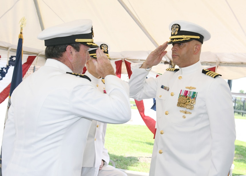 Capt. Brett O’Donovan, Commanding Officer, Naval Computer and Telecommunications Area Master Station Atlantic, salutes Capt. Robert Conner during his Change of Command July 17. Capt. Conner relieved Capt. O’Donovan as the Commanding Officer, Naval Computer and Telecommunications Area Master Station Atlantic (NCTAMS LANT). NCTAMS LANT's command mission is to operate and defend responsive, resilient, and secure computer telecommunications systems, providing information superiority for global maritime and joint forces. (U.S. Navy photo by Jason Rodman / RELEASED)