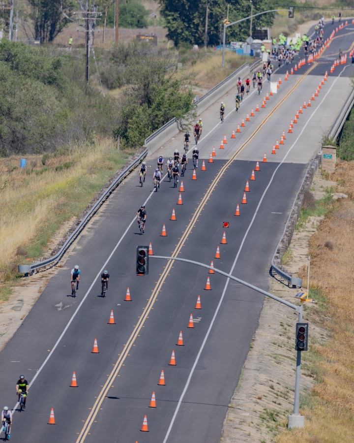 Participants compete in the cycling portion of the IRONMAN 70.3 Oceanside race at Marine Corps Base Camp Pendleton, Calif., March 28, 2026. The race consists of a 1.2-mile swim in Oceanside Harbor, a 56-mile bicycle ride through Marine Corps Base Camp Pendleton and a 13.1-mile run to the Oceanside Pier. The annual event, which travels through a portion of MCB Camp Pendleton, helps the installation maintain strong community relations with the city of Oceanside. (U.S. Marine Corps photo by Sgt. Rafael)