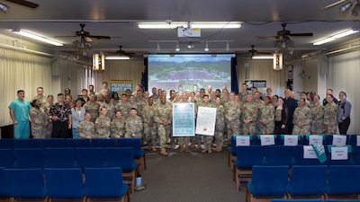 U.S. Army and U.S. Navy leaders from Tripler Army Medical Center (TAMC), Desmond T. Doss Health Clinic (DDHC), and the Soldier Recovery Unit (SRU) join TAMC staff for a group photo during the Sexual Assault Awareness and Prevention Month ceremony held at the Tripler Army Medical Center Chapel on Apr. 1, 2026. The event honored Sexual Assault Awareness and Prevention Month, supporting the campaign theme: “Change through Unity: Empower. Protect. Prevent.” (Defense Health Agency photo by C.J. Caraang)