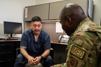 Jay Zemeheret, 559 Medical Squadron, licensed clinical social worker, guides service member during his visit for the Primary Care Behavioral Health program at Joint Base San Antonio-Randolph, Texas, March 4, 2026.