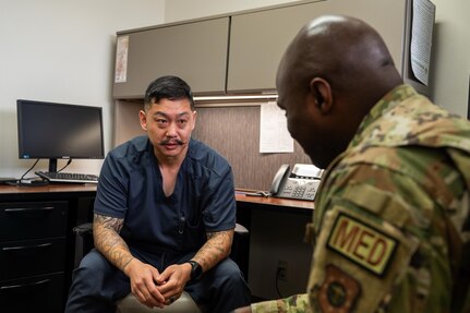 Jay Zemeheret, 559 Medical Squadron, licensed clinical social worker, guides service member during his visit for the Primary Care Behavioral Health program at Joint Base San Antonio-Randolph, Texas, March 4, 2026.