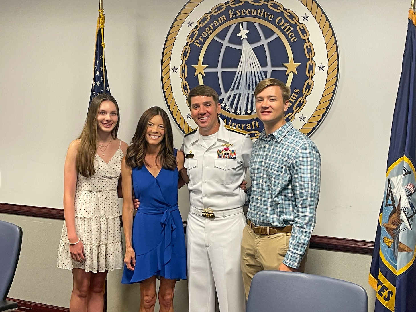 Surrounded by his family, Dougherty marks his promotion to rear admiral. From left: daughter Julia, wife Michelle, John IV and son John V.