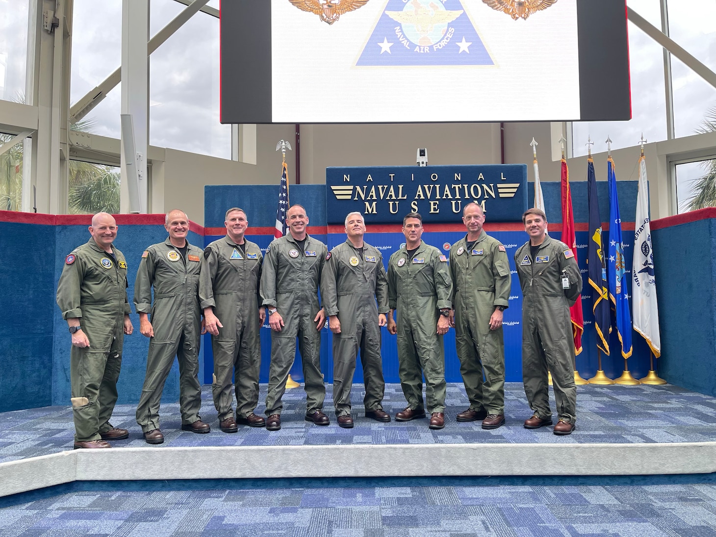 U.S. Naval Academy Class of 1995 flag officers, including Dougherty, far right, gather at the Aviation Flag Officers Training Symposium at the National Naval Aviation Museum onboard Naval Air Station Pensacola, Florida, in May 2025.