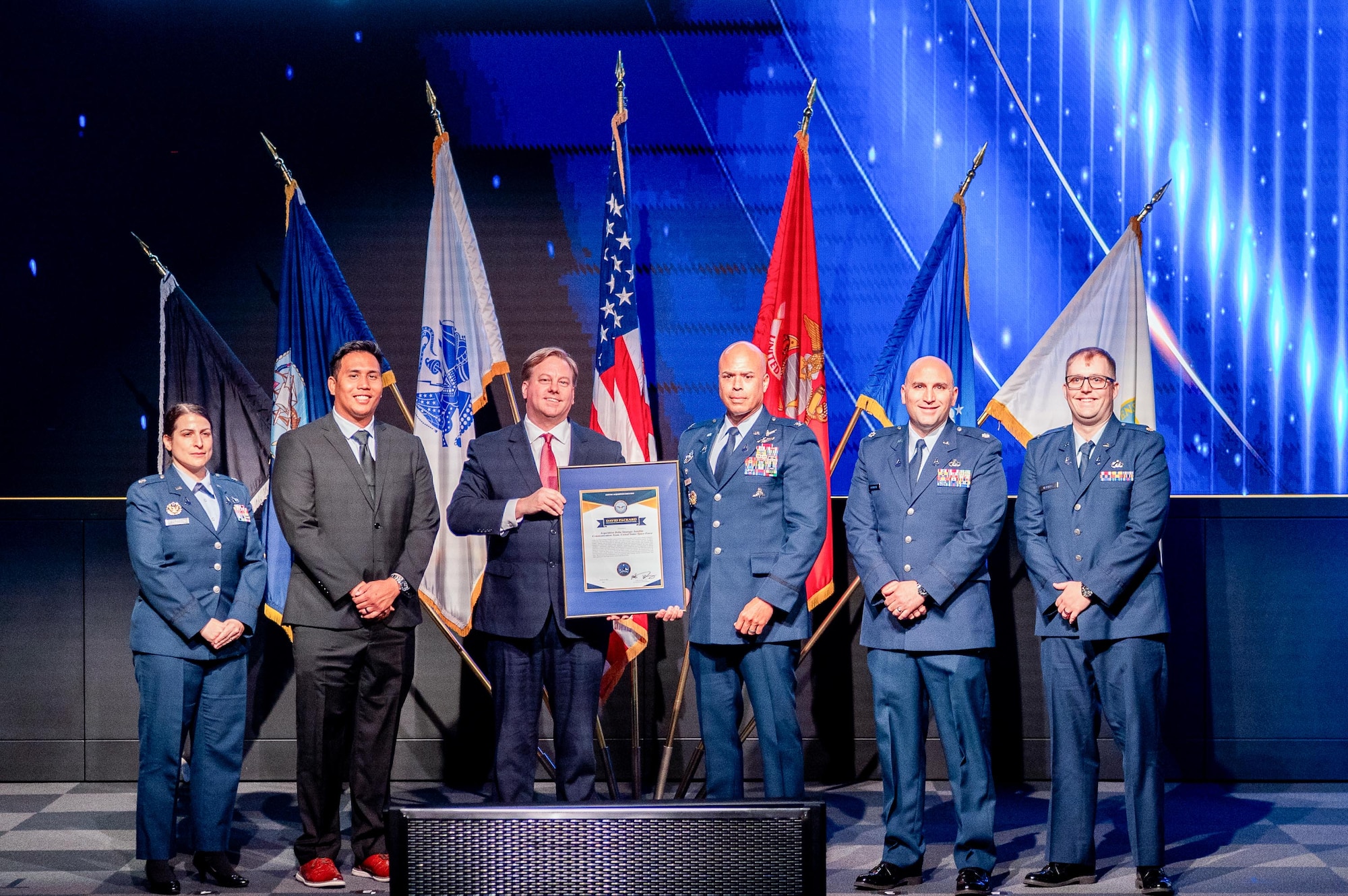 Space Systems Command’s Systems Delta 88 SATCOM receives the U.S. Department of War’s highest acquisition team award March 19, 2026 at the Warfighting Acquisition University in Fort Belvoir, Virginia. Pictured from left to right are: Lt. Col. Laila Barasha, Conrad Chong, Michael P. Duffy, undersecretary of war for acquisition and sustainment, Col. A.J. Ashby, Lt. Col. Kevin Springer, and Maj. Dale Hartley.
