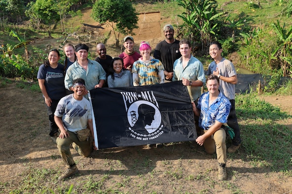 Team members of Recovery Team 3, part of Defense POW/MIA Accounting Agency Joint Field Activity 26-3LA, pose for a group photo with the POW/MIA flag at the end of recovery operations in Laos, March 27, 2026.