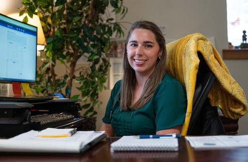 Hannah Fry, 42d Force Support Squadron Exceptional Family Member Program family support coordinator, poses for a photo at her desk at Maxwell Air Force Base, Alabama, March 25, 2026.