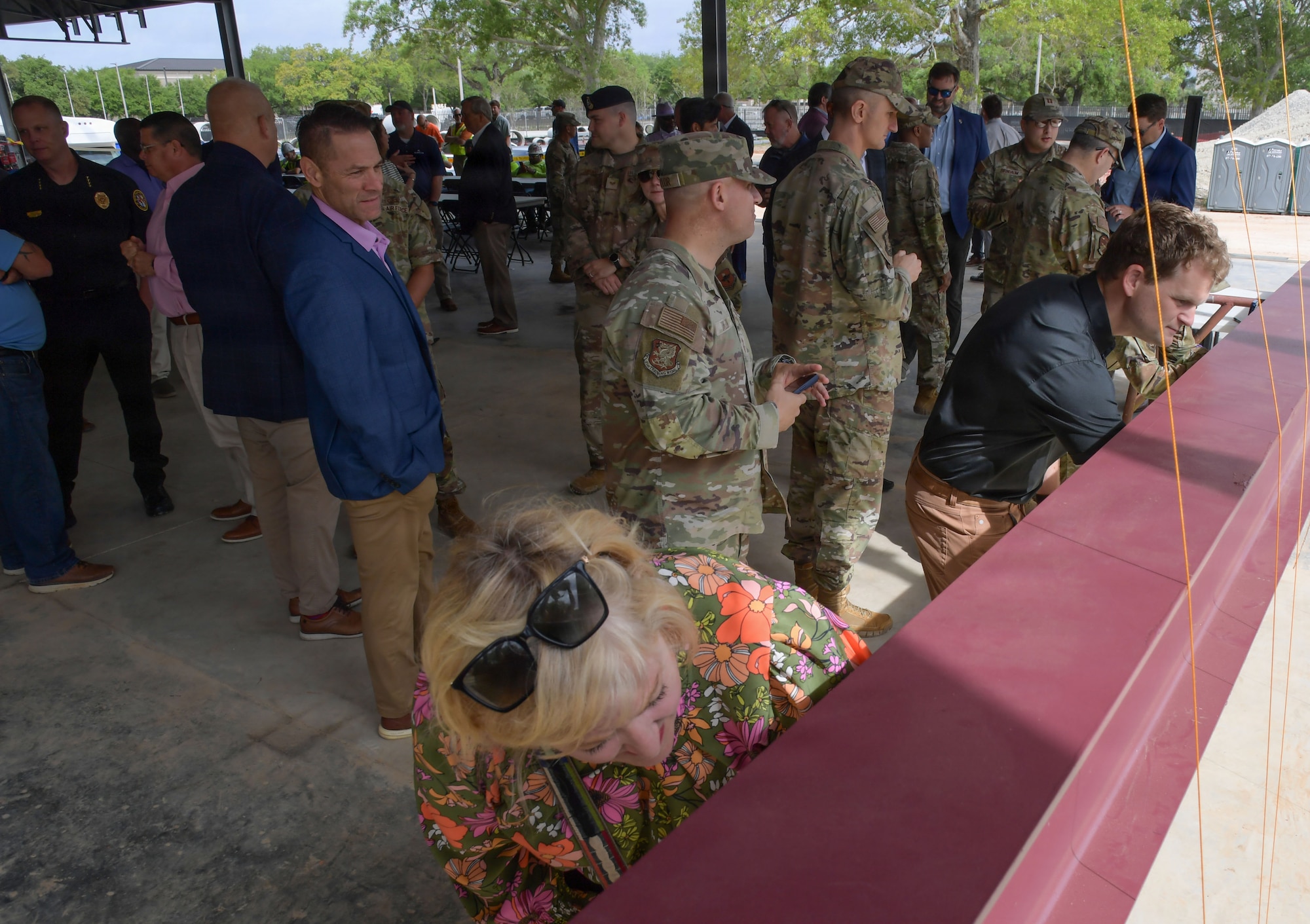 People sign a steel beam.