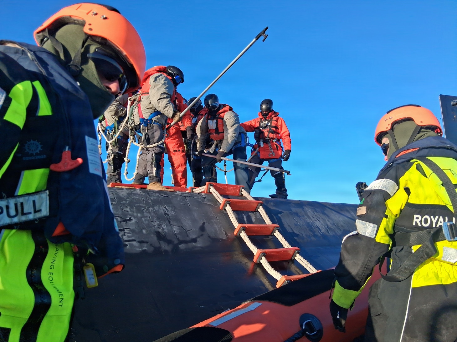 260221-N-N0736-1003 NUUK, Greenland (Feb. 21, 2026) – Members of the Royal Danish Navy assigned to the offshore patrol vessel HDMS VAEDDEREN (F 359) embark the Virginia-class fast-attack submarine USS Delaware (SSN 791) ) in preparation for a personnel transfer. Delaware is operating in the U.S. Naval Forces Northern Command (NAVNORTH) area of operations. NAVNORTH is the maritime component of U.S. Northern Command (USNORTHCOM) and is responsible for homeland defense, maritime security, and theater security cooperation in the Arctic and North American maritime approaches. (Courtesy photo)