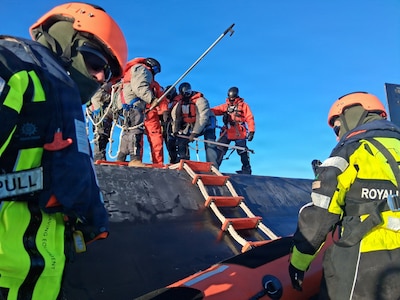 260221-N-N0736-1003 NUUK, Greenland (Feb. 21, 2026) – Members of the Royal Danish Navy assigned to the offshore patrol vessel HDMS VAEDDEREN (F 359) embark the Virginia-class fast-attack submarine USS Delaware (SSN 791) ) in preparation for a personnel transfer. Delaware is operating in the U.S. Naval Forces Northern Command (NAVNORTH) area of operations. NAVNORTH is the maritime component of U.S. Northern Command (USNORTHCOM) and is responsible for homeland defense, maritime security, and theater security cooperation in the Arctic and North American maritime approaches. (Courtesy photo)