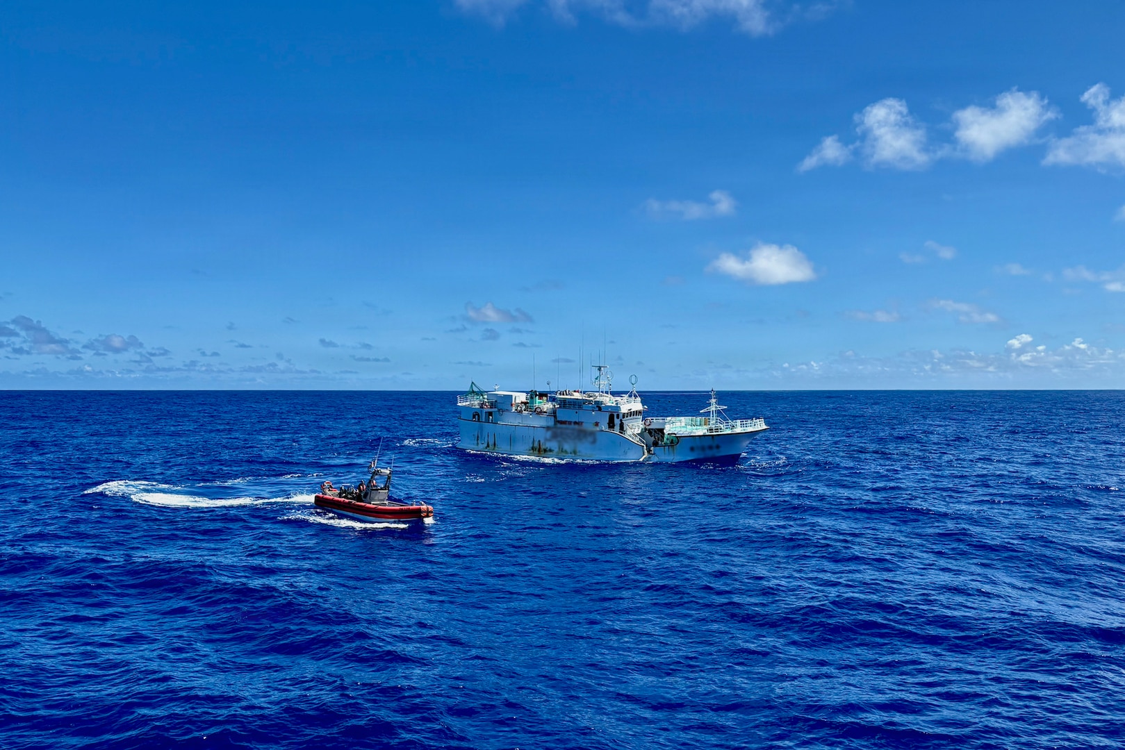 The USCGC Oliver Henry (WPC 1140) crew conduct a maritime law enforcement boarding on a foreign-flagged commercial fishing vessel under the Western and Central Pacific Fisheries Commission authority in the Pacific Ocean on March 5, 2026, to ensure compliance with applicable regulations. The crew of the USCGC Oliver Henry (WPC 1140) returned to Guam on March 29, 2026, closing out a 29-day patrol period that restored a critical tsunami early warning station to a remote Pacific atoll, delivered humanitarian supplies to two island communities, and enforced fisheries laws across more than 4,000 nautical miles. (U.S. Coast Guard photo)
