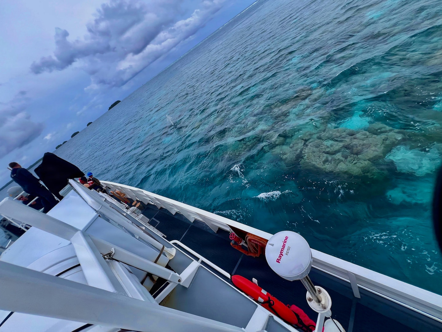 The crew of USCGC Oliver Henry (WPC 1140) carefully navigates into the lagoon of Kapingmarangi Atoll, Federated States of Micronesia, on March 19, 2026, in conjunction with supporting a supply delivery and a University of Hawai’i Sea Level Center technician to upgrade a regional NOAA weather monitoring station. Oliver Henry is the first Fast Response Cutter to make the transit. USCGC Oliver Henry (WPC 1140) returned to Guam on March 29, 2026, closing out a 29-day patrol period that restored a critical tsunami early warning station to a remote Pacific atoll, delivered humanitarian supplies to two island communities, and enforced fisheries laws across more than 4,000 nautical miles. (U.S. Coast Guard photo)