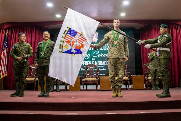 From left, Philippine Army Brig. Gen. Lennon Babilonia, the Philippine exercise director; Philippine Army Maj. Gen. Efren Morados, vice commander of the Philippine Army; and U.S. Army Maj. Gen. James Bartholomees, commanding general of the 25th Infantry Division, unveil the official exercise flag during the opening ceremony for Salaknib 2026 at Fort Magsaysay, Philippines, April 6, 2026.